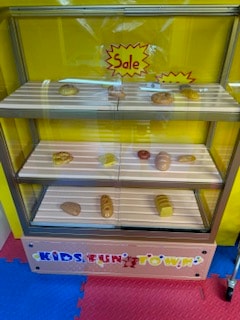 Pretend bakery display case at Kids Fun Town